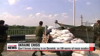 Ukrainian forces close in on Donetsk, as UN warns of mass exodus