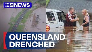 Floodwaters trap driver in Queensland | 9 News Australia