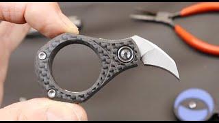 CIVIVI Pyrus: A pear-shaped hawkbill double-slip joint carbon fiber EDC ring knife.