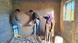 Plastering Rasool's house of love with the help of a master plasterer