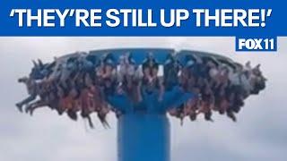 Riders get stuck upside down on roller coaster for about 30 minutes