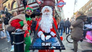 Crazy DJ Santa in London giving out presents