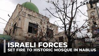 Israeli forces storm and set fire to historic mosque in Nablus amid West Bank raids