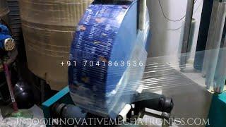 LAMINATED ROLL WRAPPING MACHINE