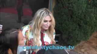 Singer Kesha makes her fans happy by signing autographs for them