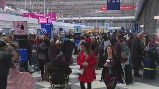 Travelers pack airports as busy holiday travel season gets underway