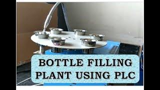 AUTOMATIC BOTTLE FILLING  PLANT / MACHINE USING PLC | (ALLEN BRADLEY-1400 SERIES)