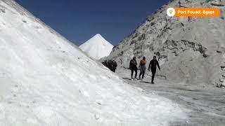 Egyptians slide on salt in lieu of snow