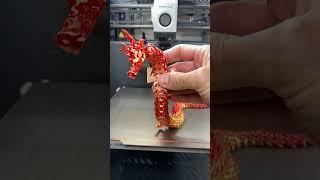 Articulated Christmas Dragon by P1lotz on Thingiverse: https://www.thingiverse.com/thing:5676934