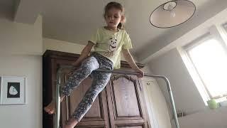 Gymnastics tricks on the bar for kids