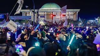 ‘Mass jubilation’ outside South Korea’s parliament after president impeached