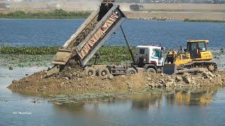 Stronger Road Construction Machines Dozer Pushing Dirt Vs Dump Truck Unloading Dirt in Action