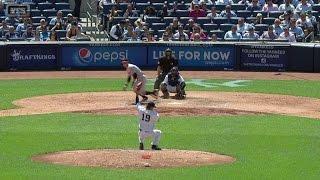 BAL@NYY: Tanaka protects his face by snaring a liner