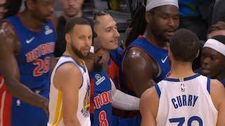 Steph Curry gets into it with Isaiah Stewart on Pistons bench and Stewart shoves Curry