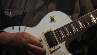 Agile 2500 Les Paul style guitar demo through a Roland Cube Street EX Amp.