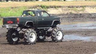 NISSAN MEGA TRUCK MUD BOGGING & A GIRL DRIVING.