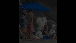 Leonardo DiCaprio relaxing with friends and father on the beach in Malibu.