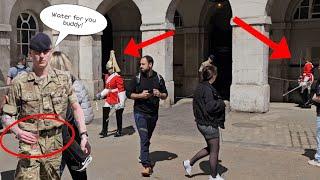 Two Guards Swaps Position at the Arches while The Soldier Gave Her Water