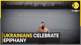 Ukrainians Celebrate Epiphany with Traditional Plunge into the Dnipro River | World News | WION