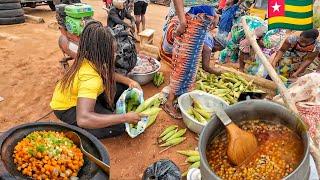 Cooking delicious corn and beans porridge in Togo west Africa.