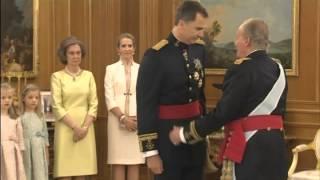 Spain's new king Felipe VI receives the royal sash