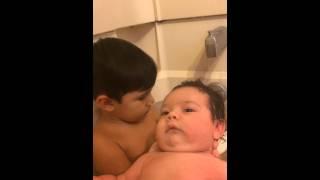 TODDLER GIVES BABY BROTHER A BATH !