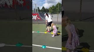 Selena practising tennis skills aged 3