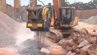 MB crusher bucket crushing blue granite in China