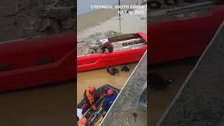 SCENE: South Korean rescuers pull nine bodies from tunnel flooded during days of heavy rain