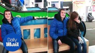 Smooth escalator! Boy makes girl blush in under five seconds - Daily Mail