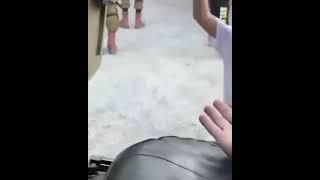 Israeli soldiers play football with some children in Hebron