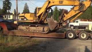 Off Loading Cat 315 Excavator From Peerless Lowboy