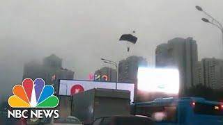 WATCH: Base Jumpers Parachute Into Busy Moscow Traffic