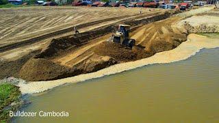 Professionals operator skills machines dozer shantui pushing Sand making new village road