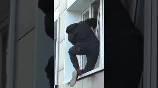 Guy Rescues Cat Stuck in Window