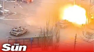 Footage appears to show Azov Battalion tanks firing down street in Mariupol, Ukraine