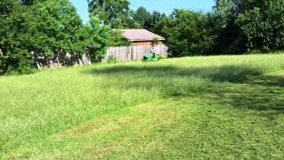 John Deere X540 mowing thick grass