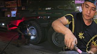 9:00 p.m. Repair punctured tire of Howo 30 ton tractor