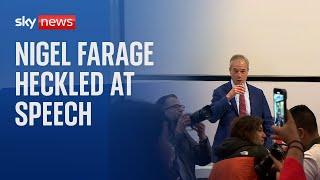 'You're a racist': Seven protesters interrupt Farage speech