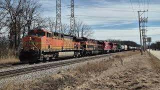 Green/black GP38 trails CPKC 247 with BNSF H2, KCS, CP power at Morton Grove