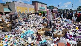 Police surround a Beauty supply store after their eviction causes chaos