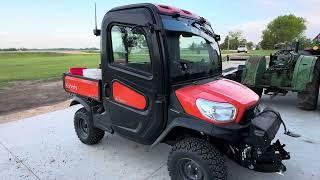 Orange Invading the Green Herd: Kubota RTVX1100C