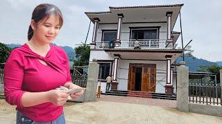 Girl paints house walls to earn extra income.