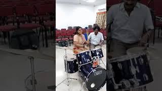 Girl playing drums rolls