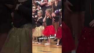 Little girl looks for her family in the crowd 