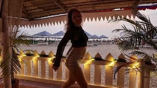 Sunset dancing of Russian blonde in Morjim Turtle beach