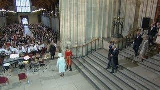 Royal trumpet fanfare as the Queen and her family arrive at Westminster Hall for lunch