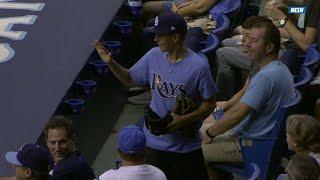 Odorizzi tosses his glove to an excited fan