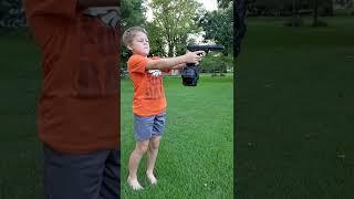 Kid shooting airsoft gun