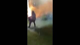 Guy using fireworks as a machine gun